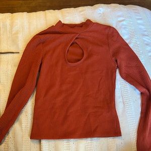 auburn shirt with hole in the middle of chest. never worn